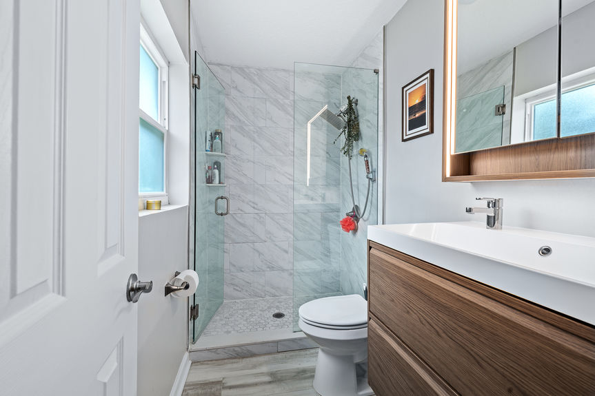Remodeled Bathroom with Walk-In Glass Shower | FL Home