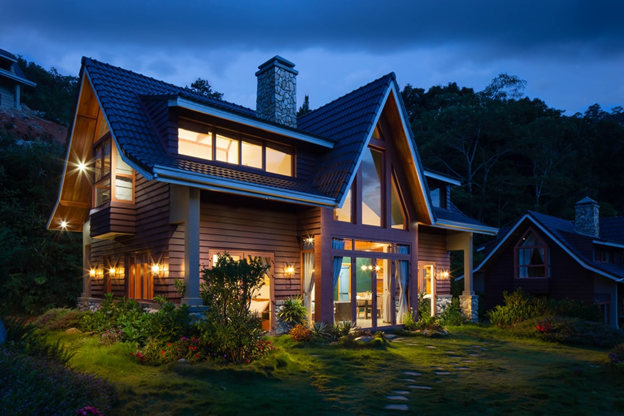 A modern house at night.