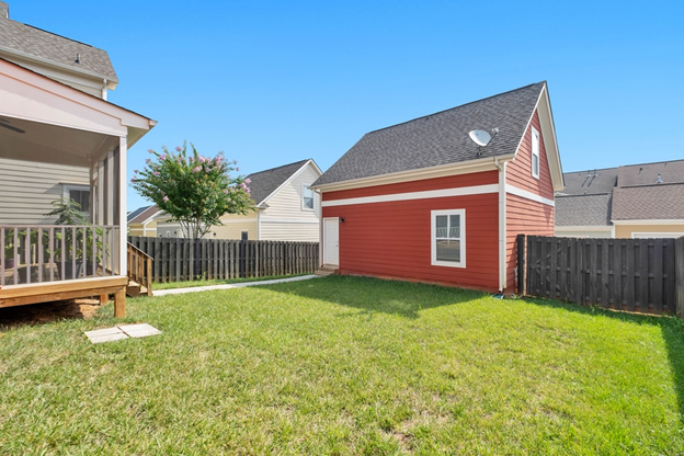 Backyard of a red and white house