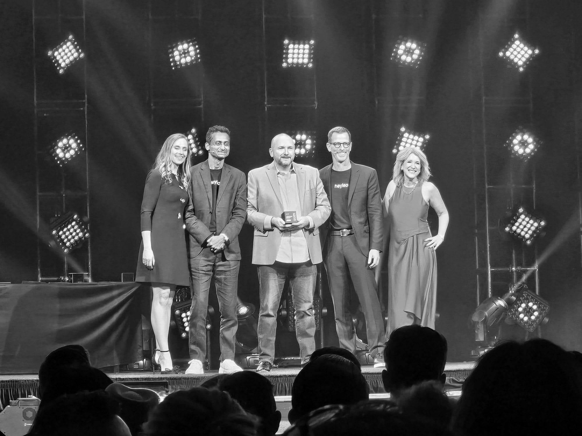 PREMIERE team accepting the #1 Mega Team award at REAL