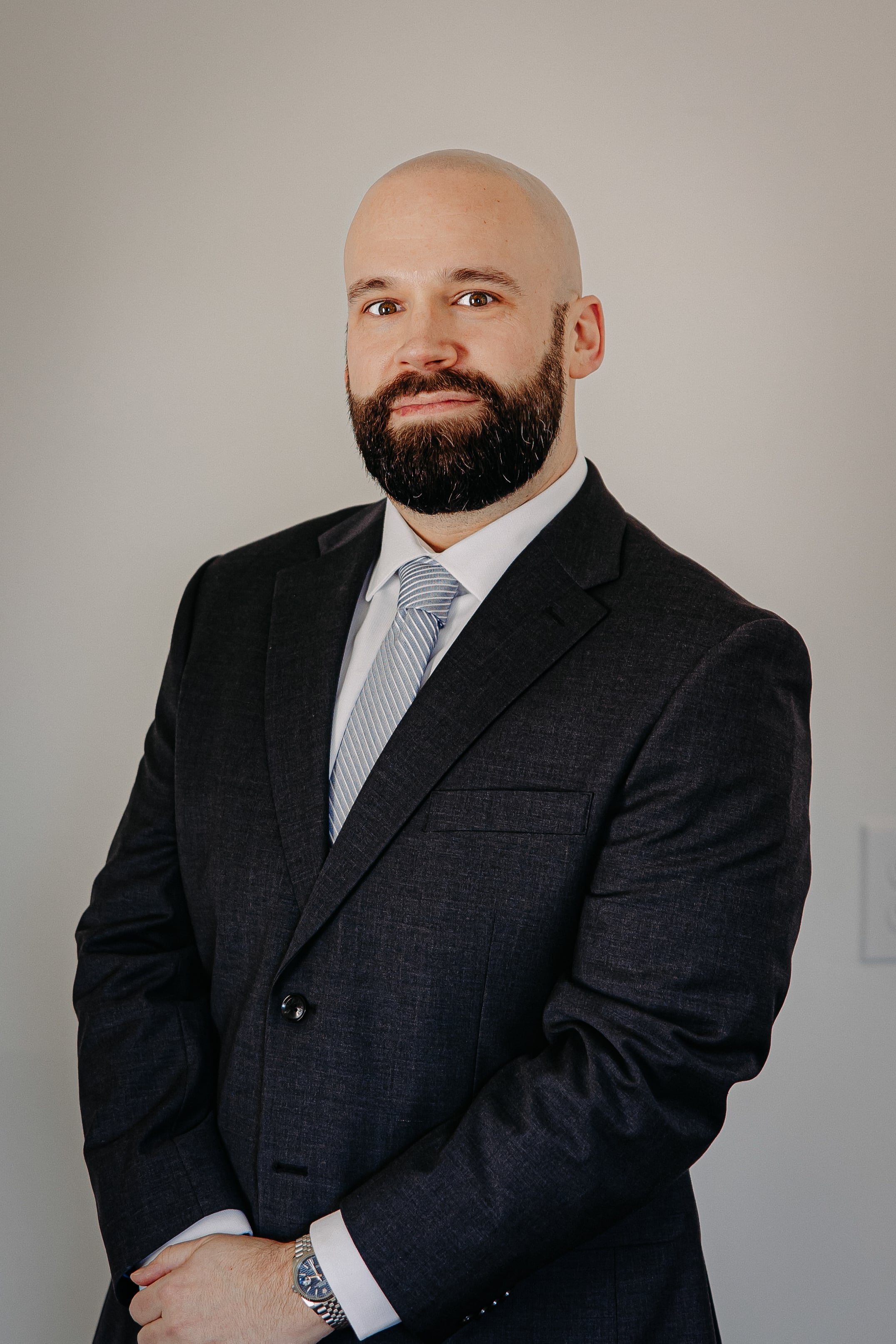 Photo of Jon Styer Wearing a Suit