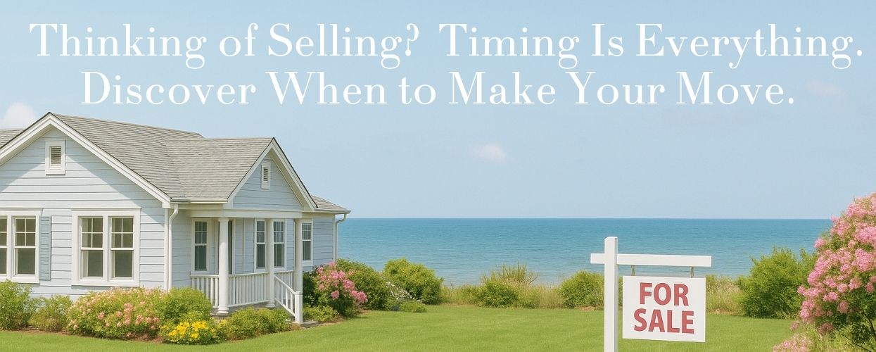 Coastal cottage with For Sale sign in front yard, ocean view in background, ideal listing season.