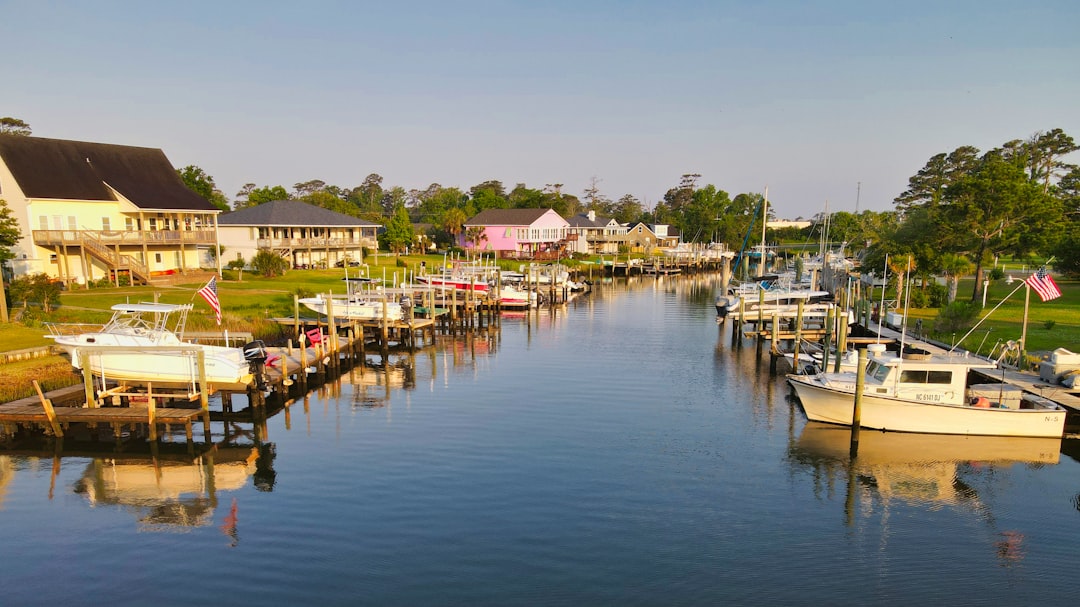 Morehead City waterfront homes and boats illustrating hurricane risk and coastal insurance factors