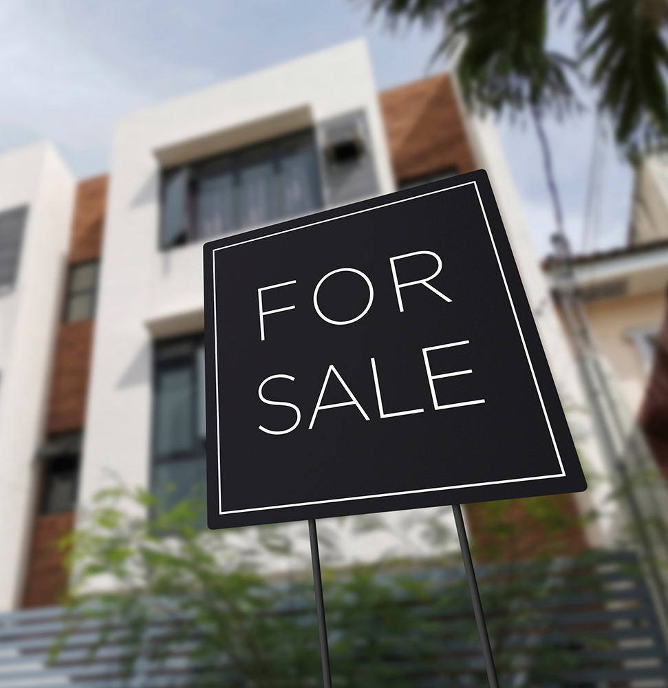 For,Sale,Sign,In,Front,Of,An,Affordable,Three,Storey