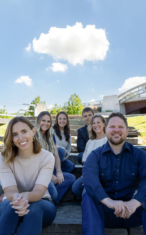 Elite Realty Partners by Real Broker team photo featuring Realtors Ben Geanetta, Kayla Hale, Kortney Leavitt, Whitney Pappas, and Luke Lopez in Sandpoint, Idaho. Experienced real estate professionals specializing in buying and selling homes throughout North Idaho