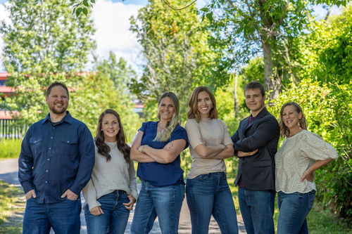 Elite Realty Partners by Real Broker team photo featuring Realtors Ben Geanetta, Kayla Hale, Kortney Leavitt, Whitney Pappas, and Luke Lopez in Sandpoint, Idaho. Experienced real estate professionals specializing in buying and selling homes throughout North Idaho