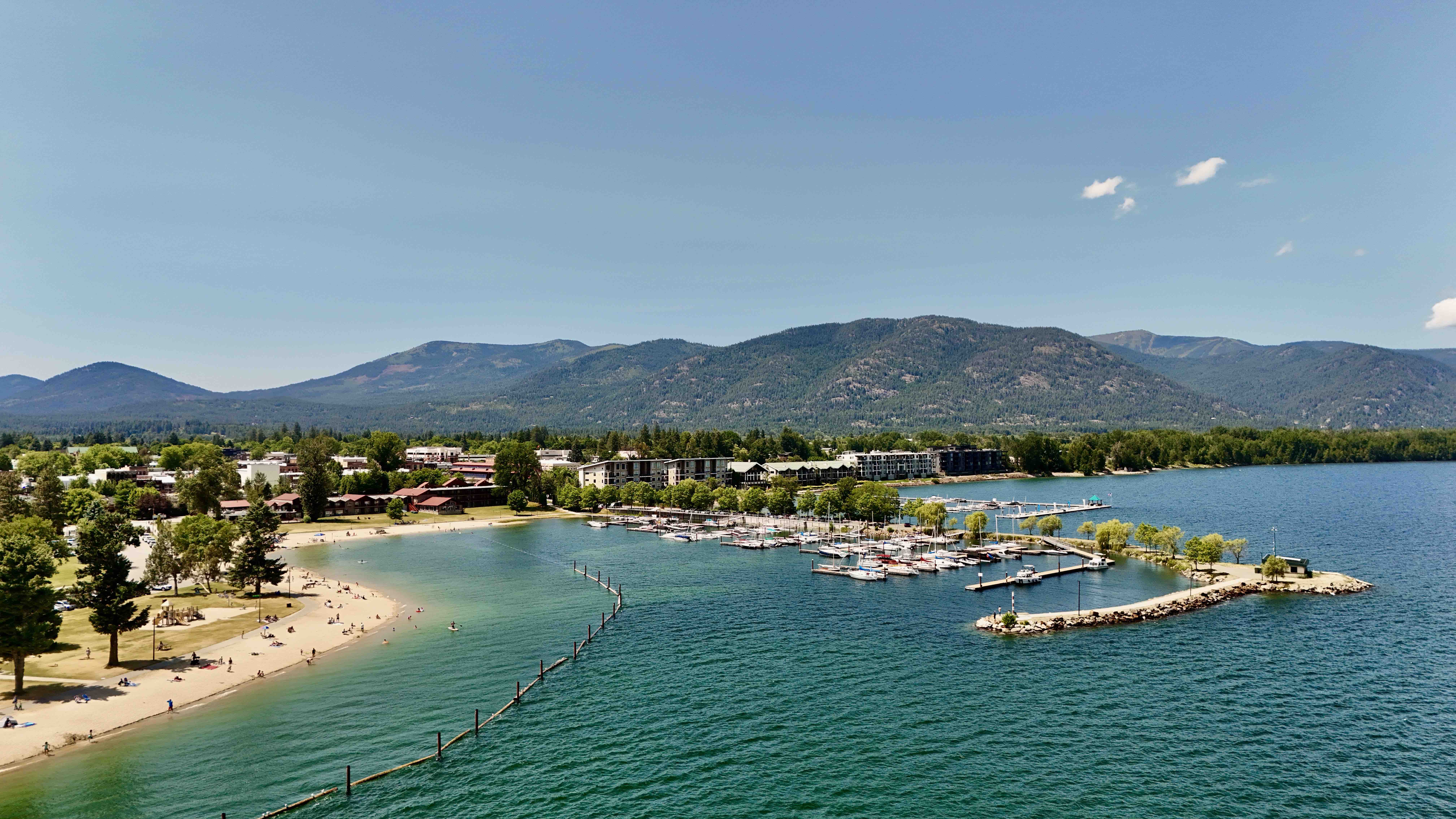 a photo of Lake Pend Oreille and windbag marina. schweiter mountain is in the back ground and the seasons condos are at the shore of the lake