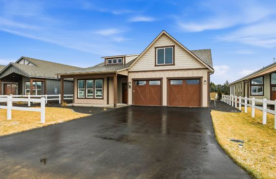 the front of a new construction home with blue skys
