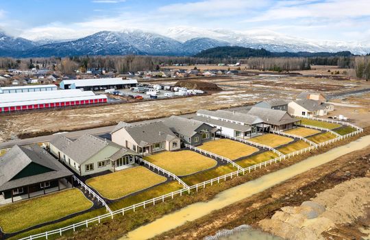 Drone photo of homes at The Lodges at Providence with Schweitzer in the background