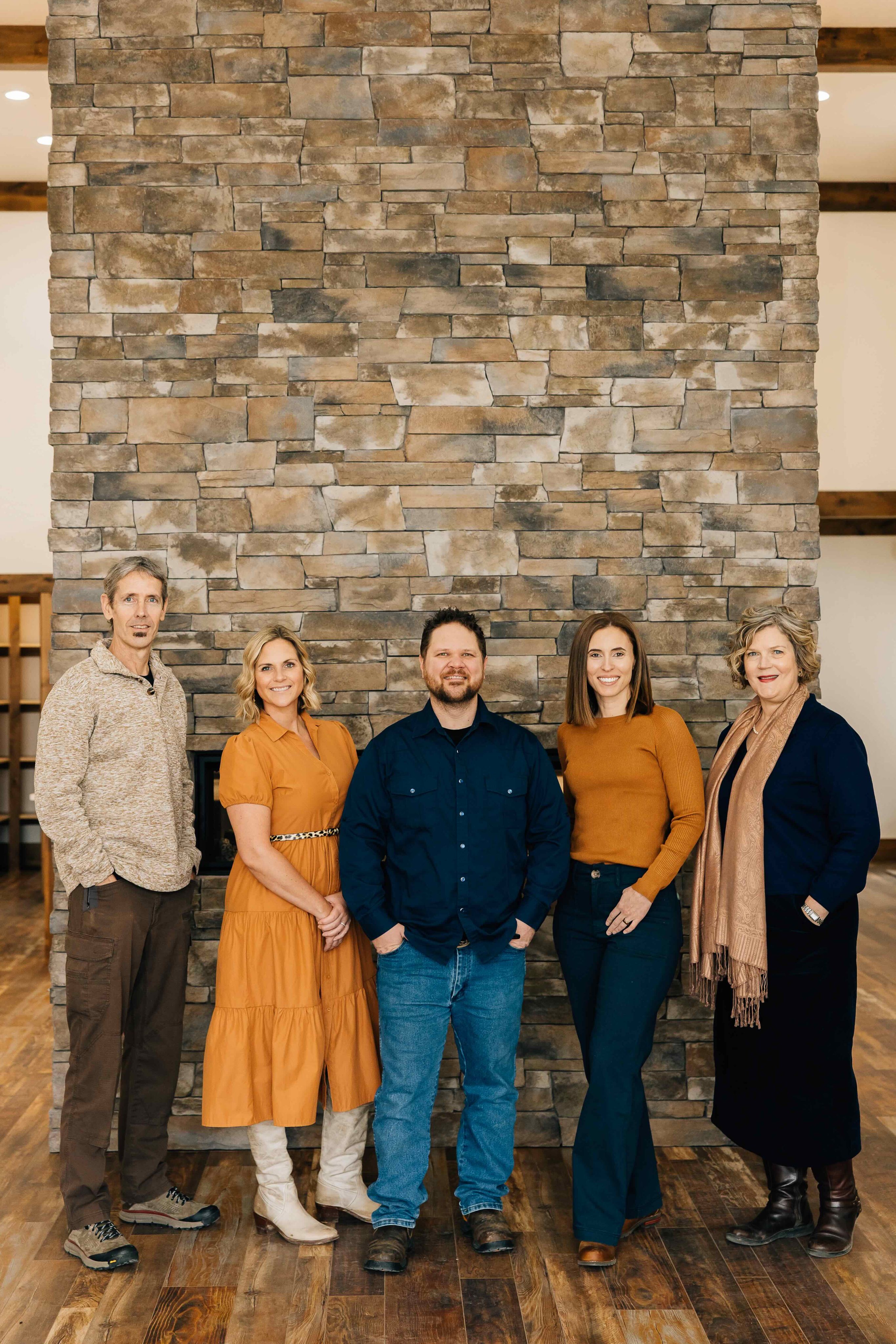 Ben Geanetta whitney pappas kortney leavitt todd bradshaw nedra kanavel standing in front of a brick fireplace