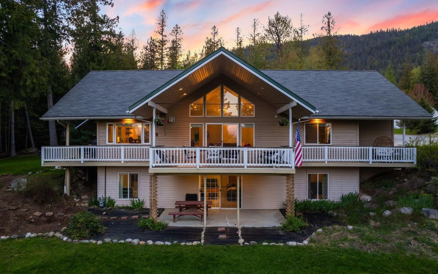 house at twllight with mountains in the background