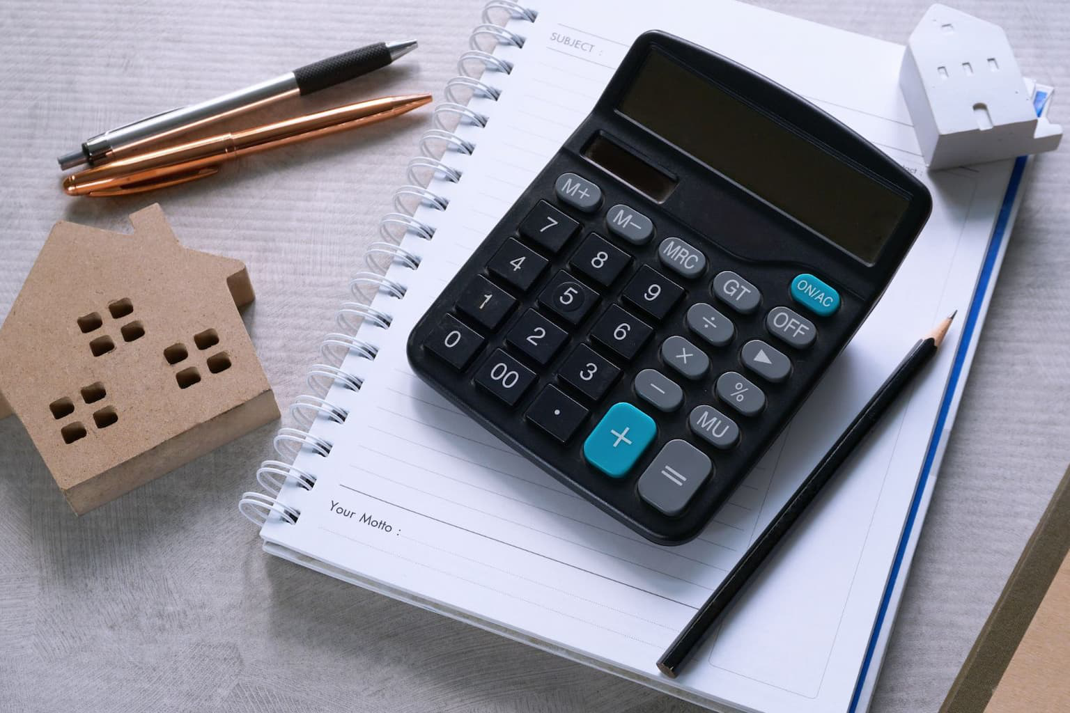 Calculator and house model used to calculate taxes on property