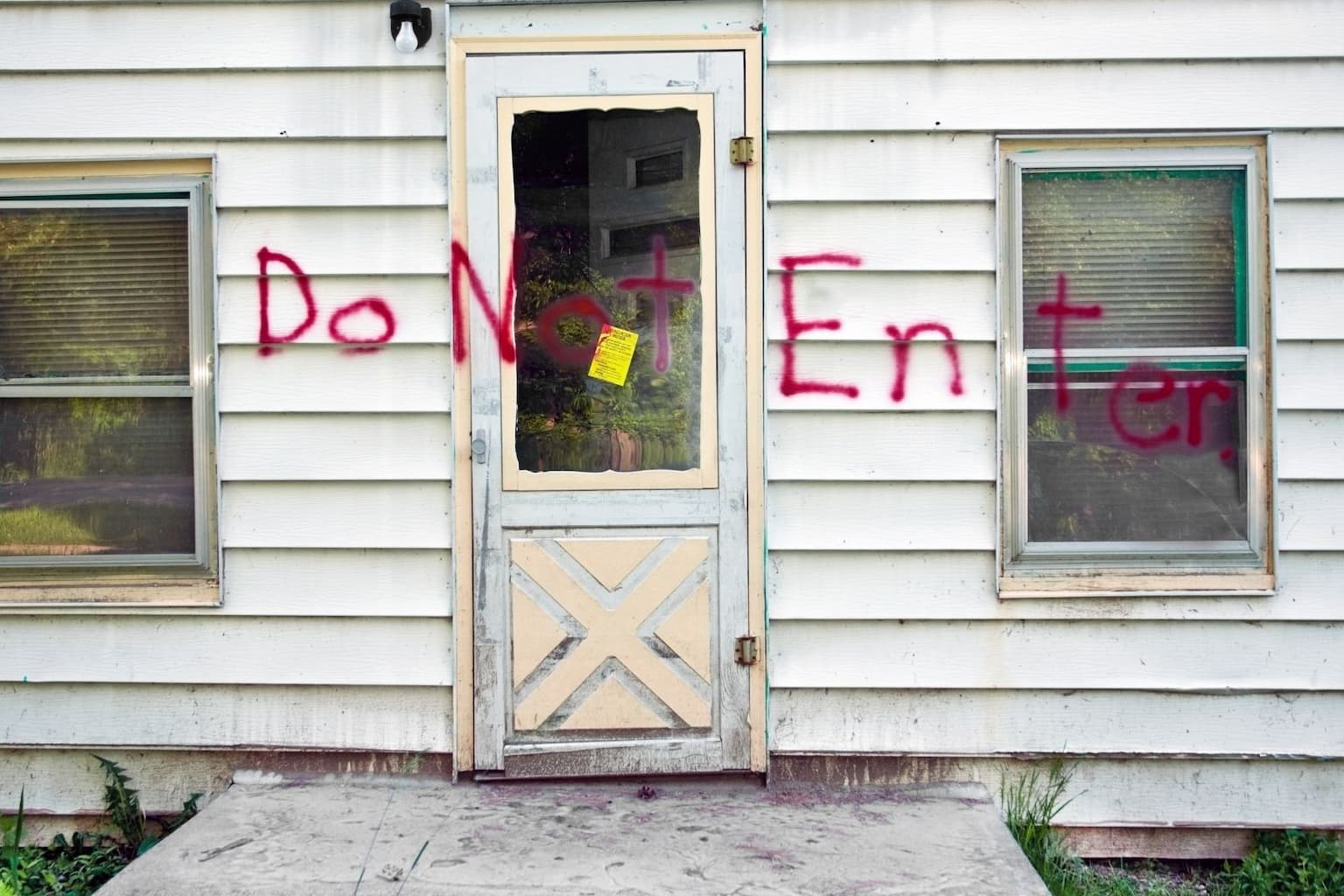 Close-up of a red “Do Not Enter” sign on a door or wall