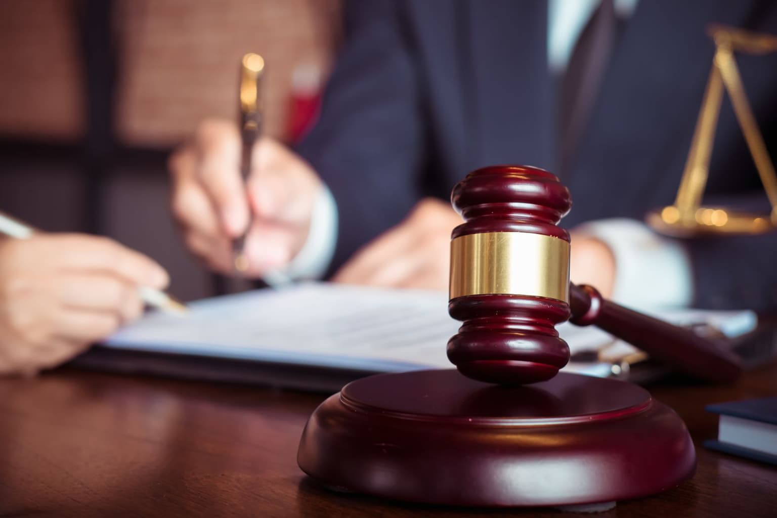 Judge reviewing probate documents for estate sale