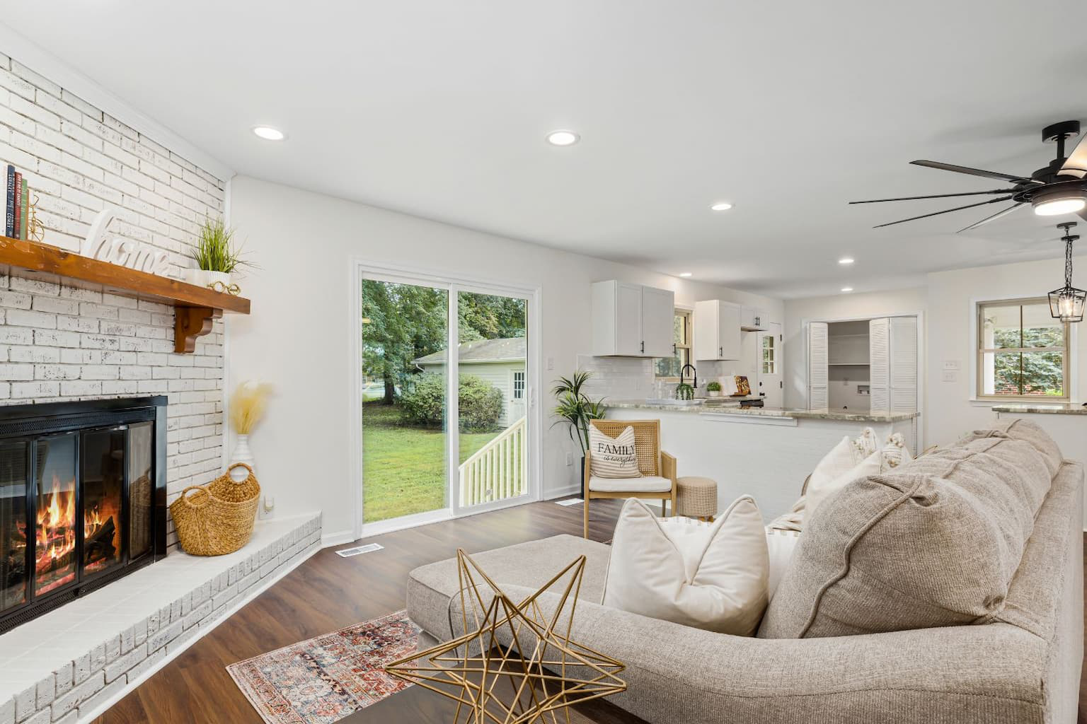 Modern, cozy living room with minimalist furniture and soft color palette after a hoarder flip