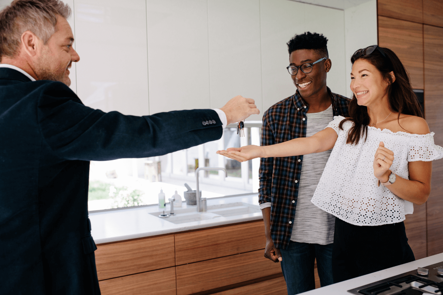 Executor handing house keys to buyer after court-approved probate sale