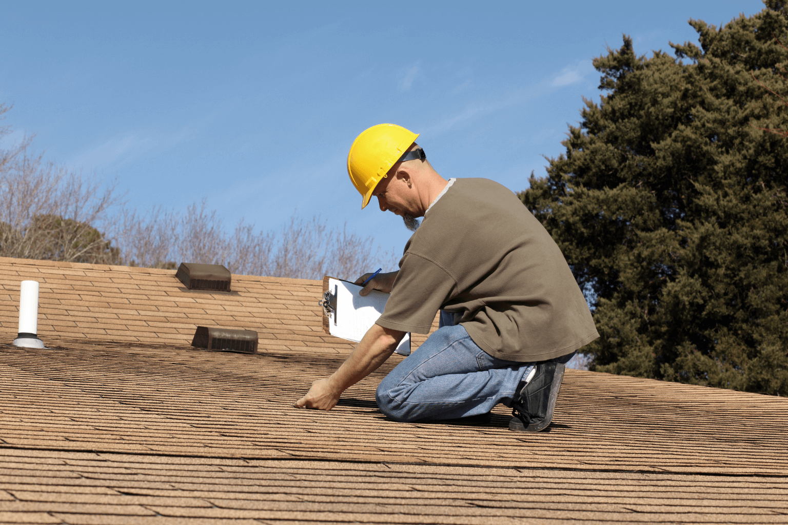 Home inspector checking roof for repairs