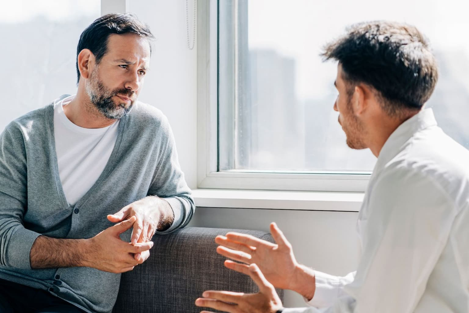 Financial counselor talking to a homeowner in distress