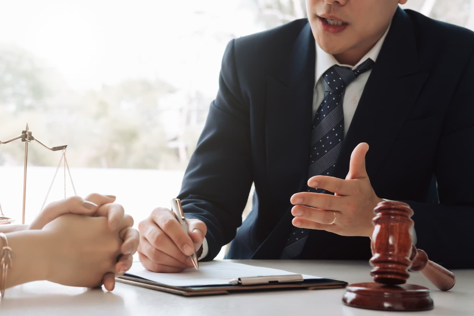 Lawyer advising homeowner with legal documents