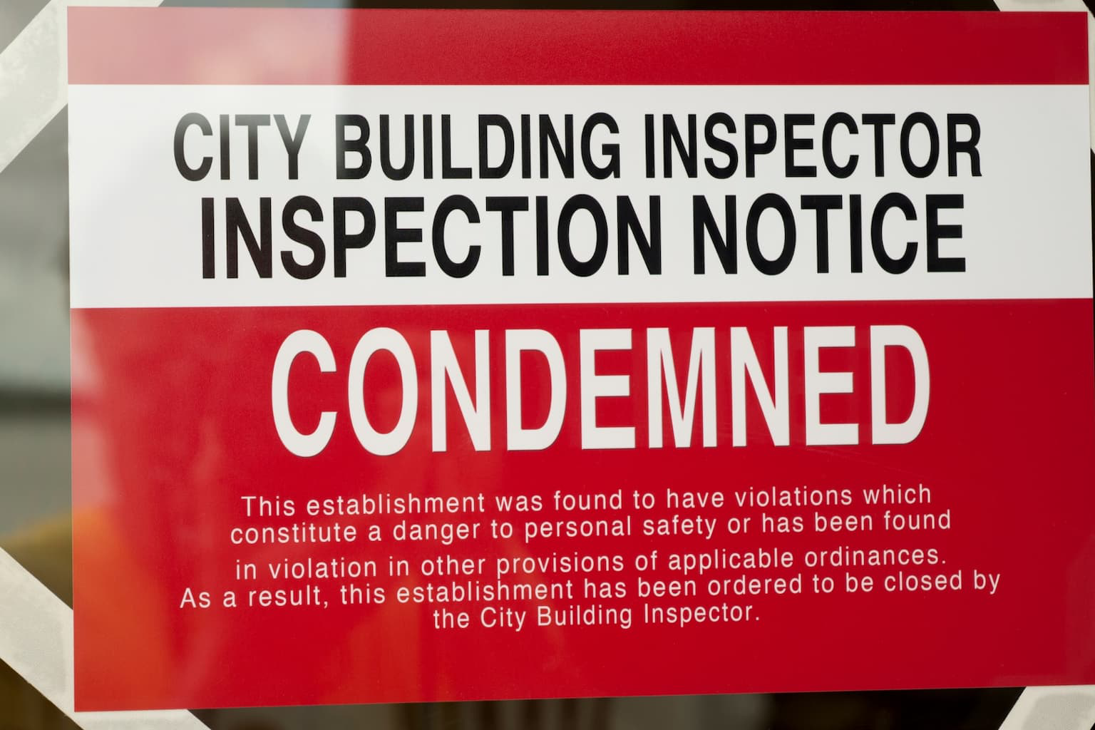 Official condemnation notice posted on a property door