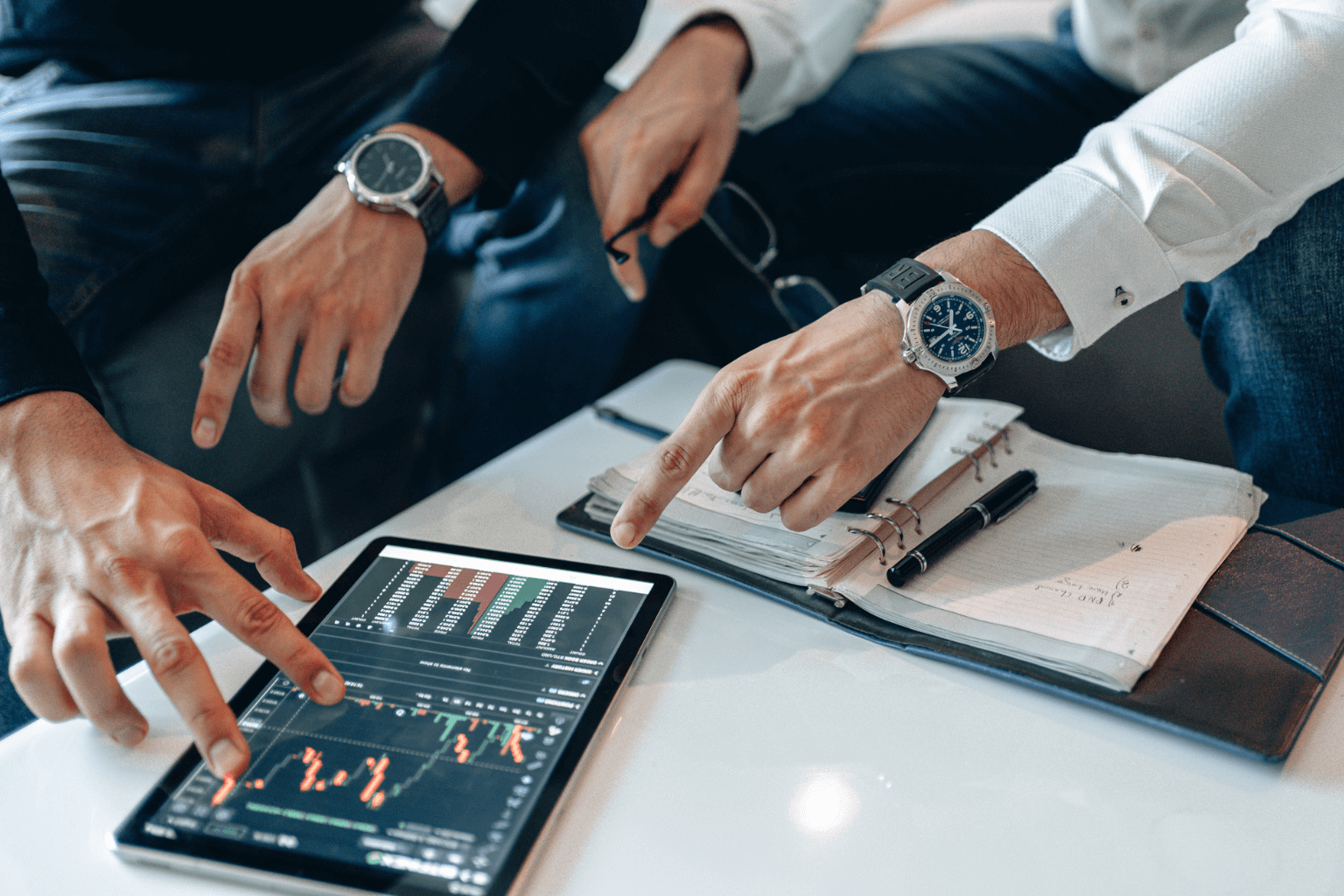 Real estate agent reviewing market data for pricing