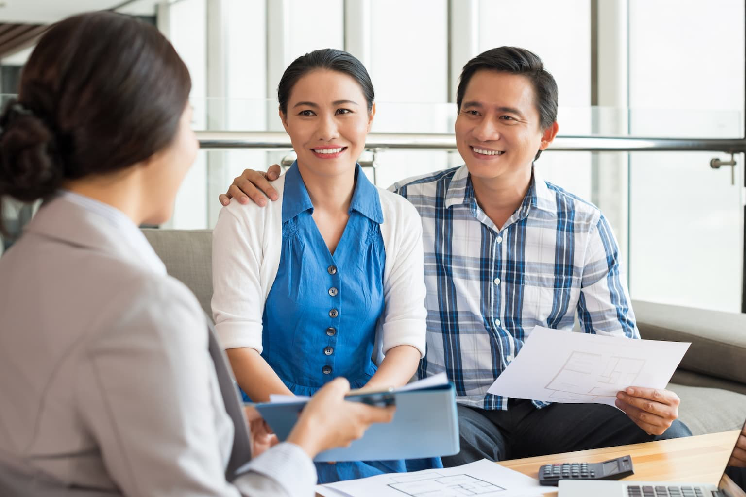 Real estate attorney advising a couple about property law