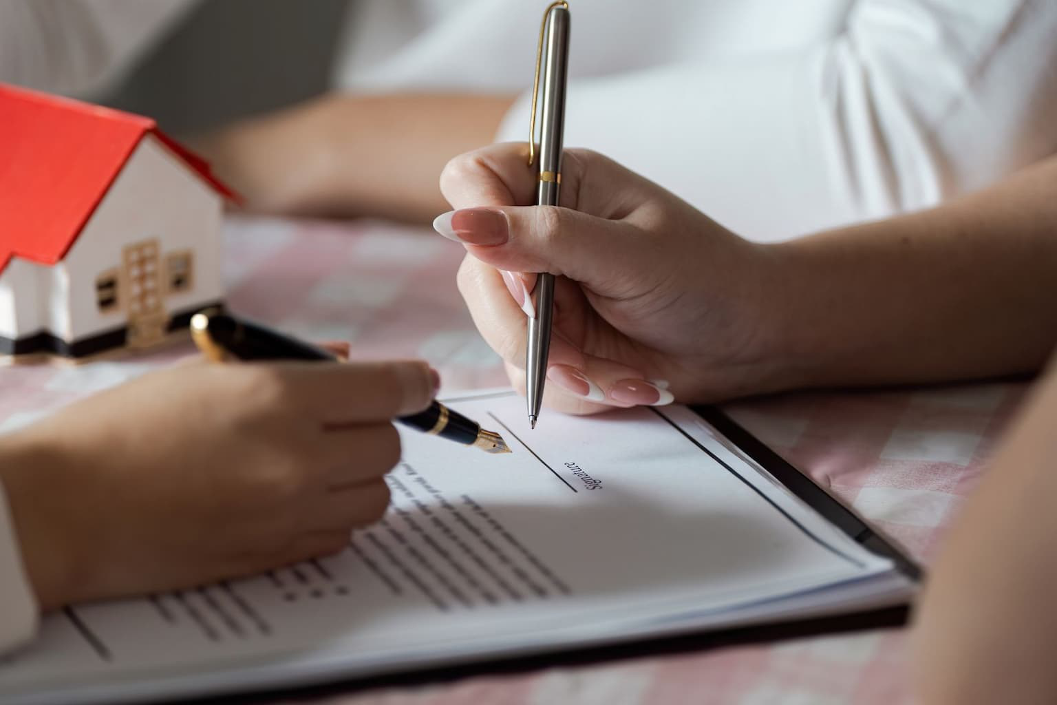 Homeowner signing documents on closing day