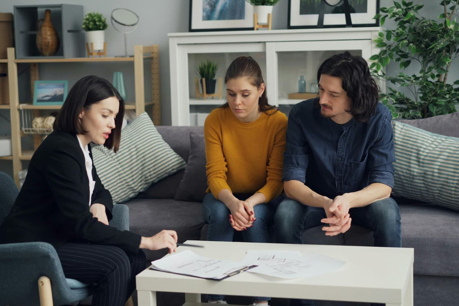 Real estate attorney reviewing paperwork with home seller