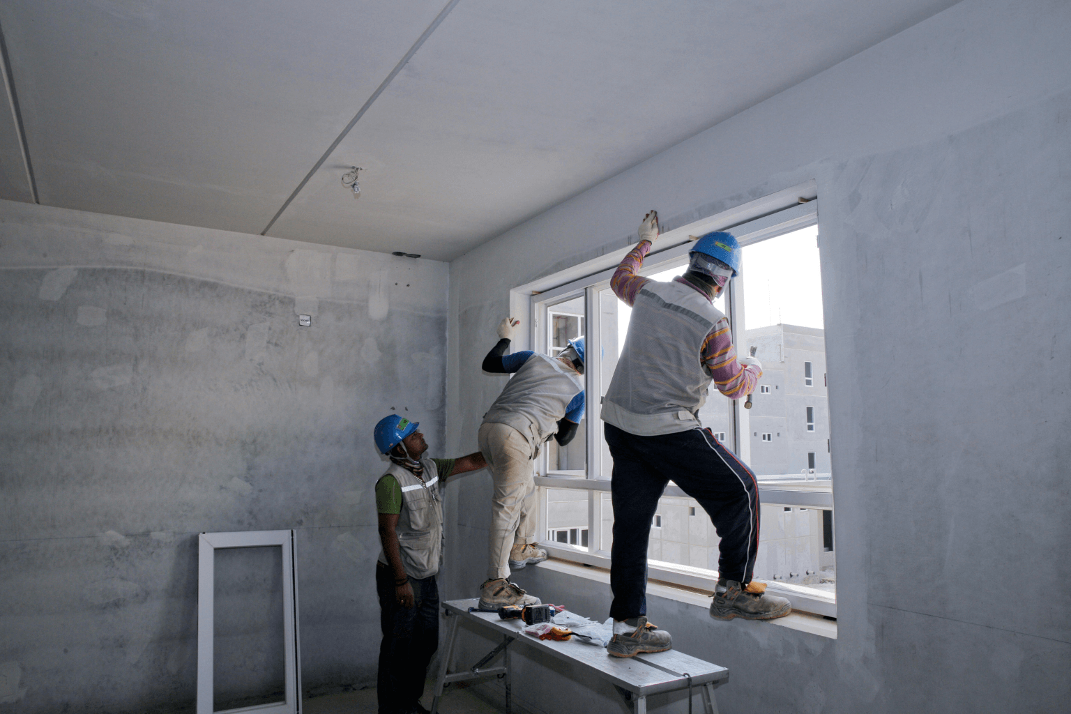restoration professionals repairing walls and removing debris