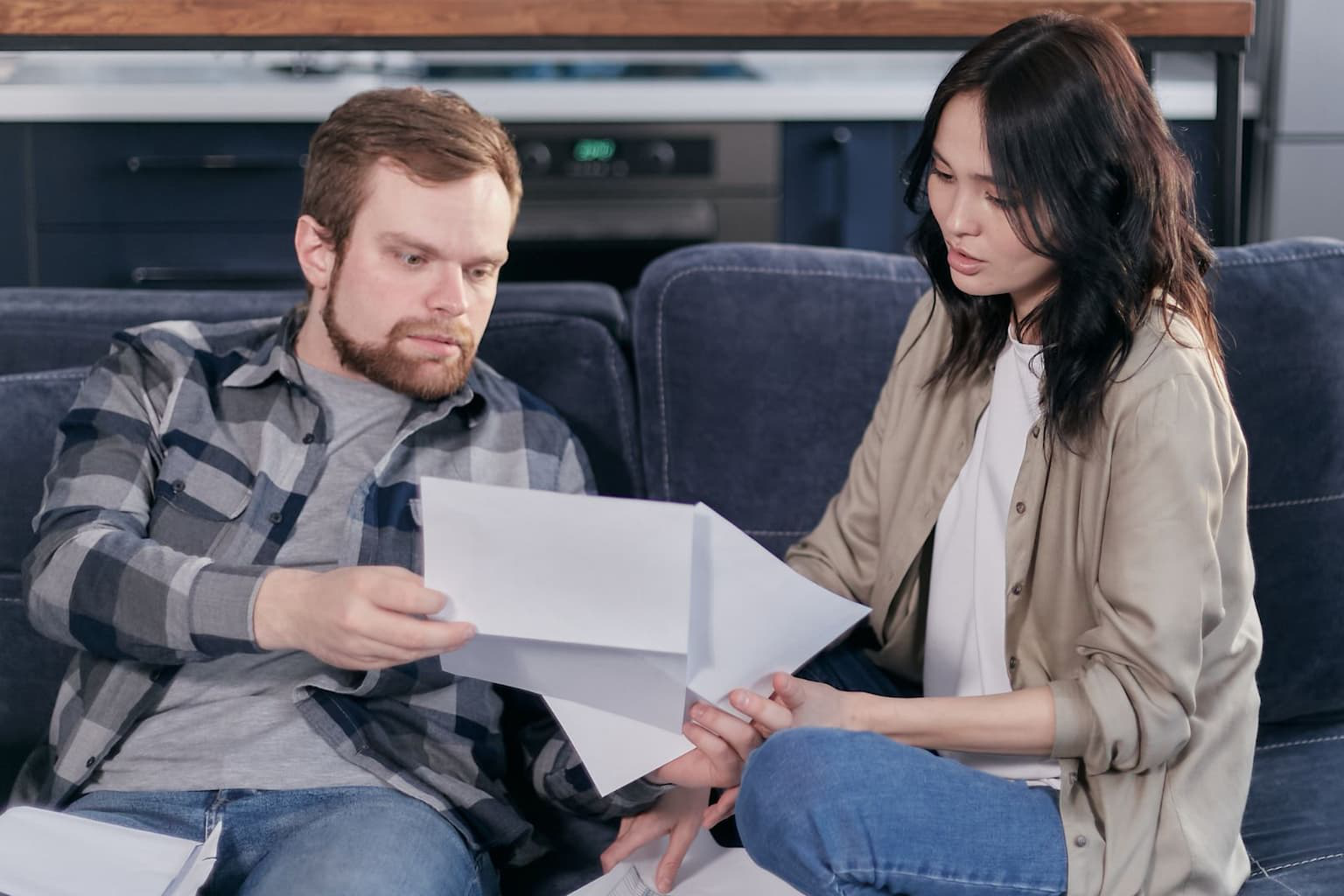 Couple reviewing inherited property documents 