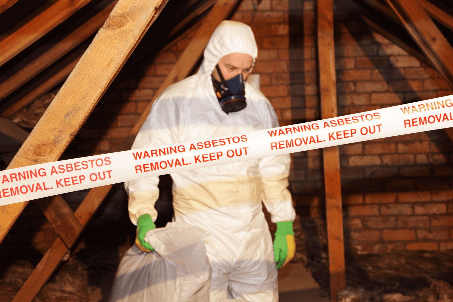 Professional removing asbestos in a California home