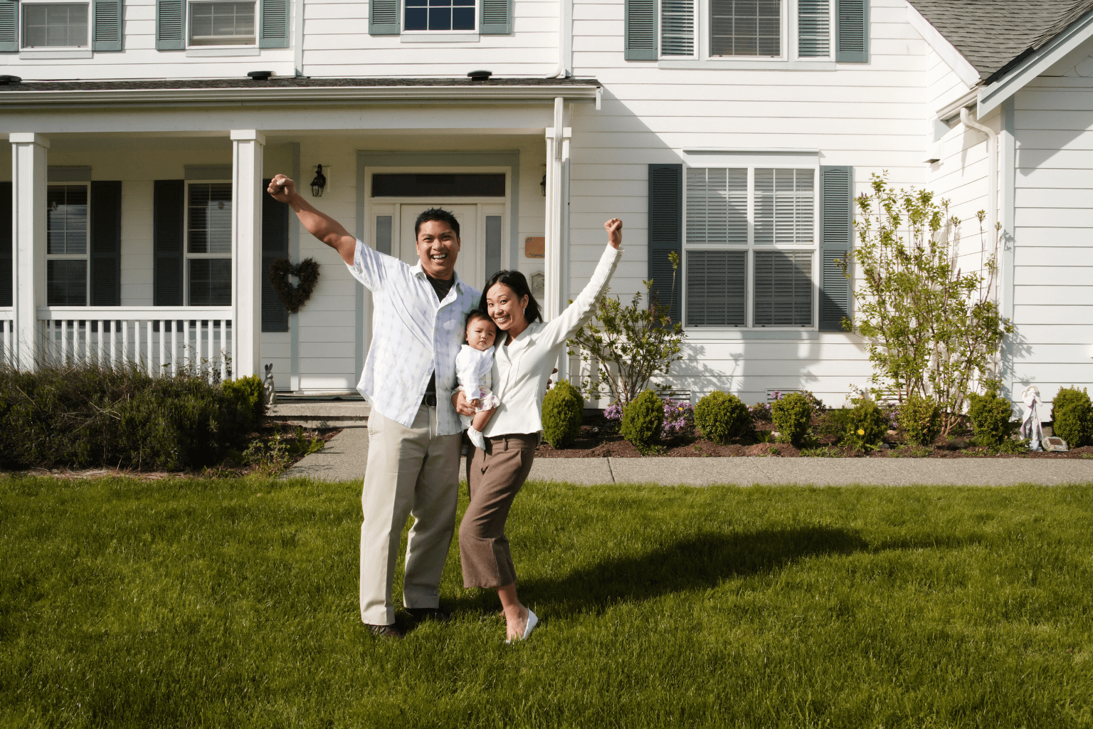 Modern California home with happy homeowners outside