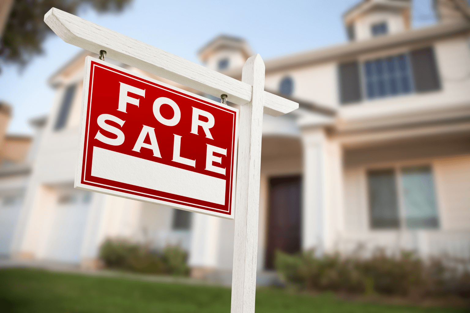 California home with for sale sign in front yard