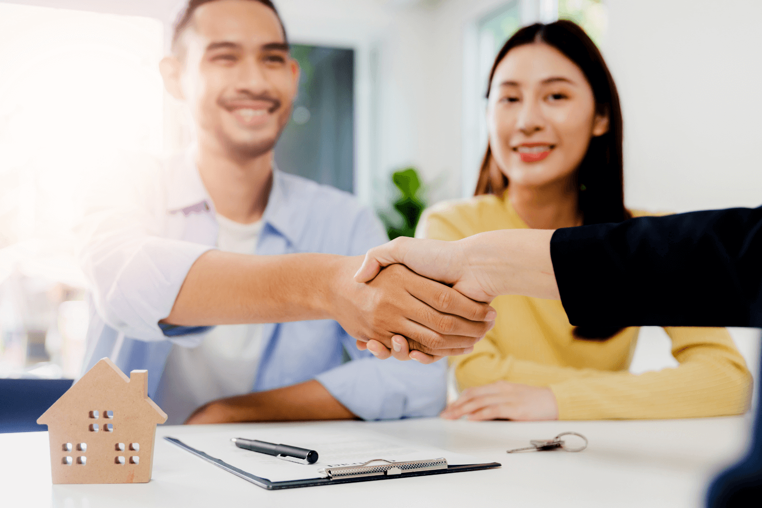 Seller shaking hands with a home buyer or investor
