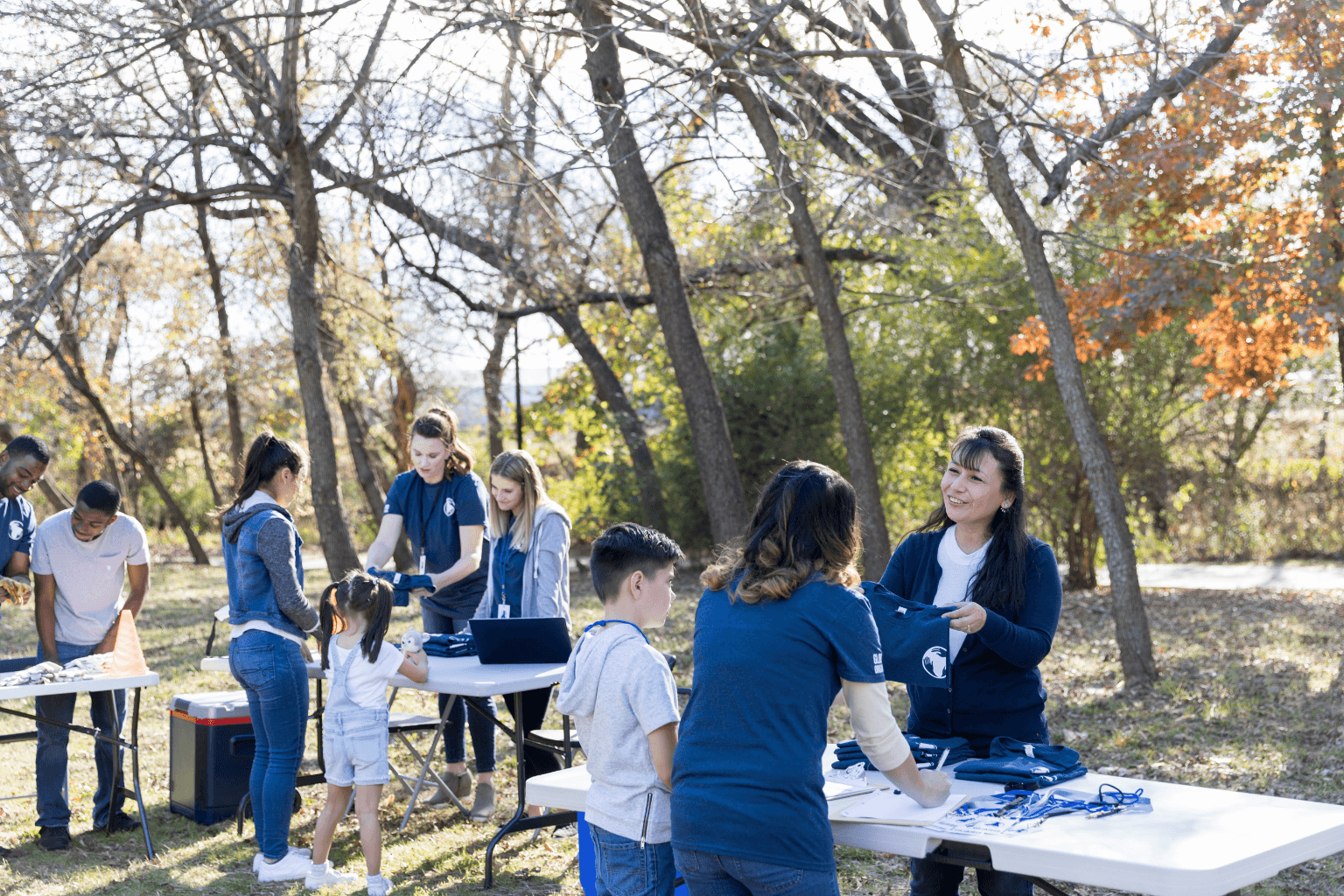 Neighbors gathering outdoors for a community clean-up event in California