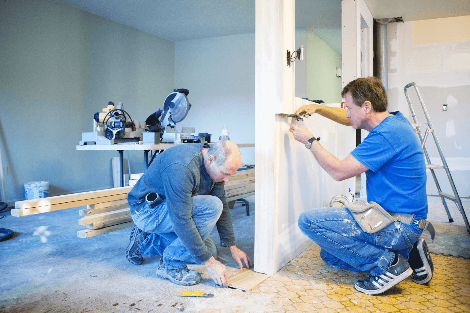Contractors repairing a damaged house during renovation