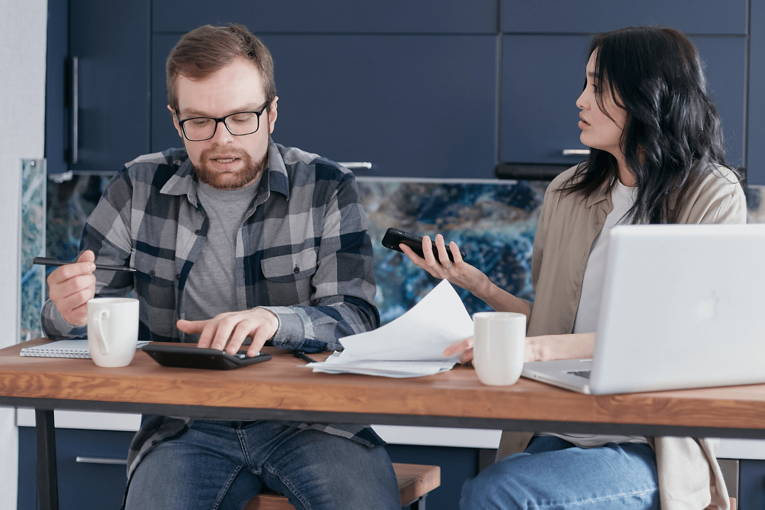 Couple discussing home sale options and disclosure of issues