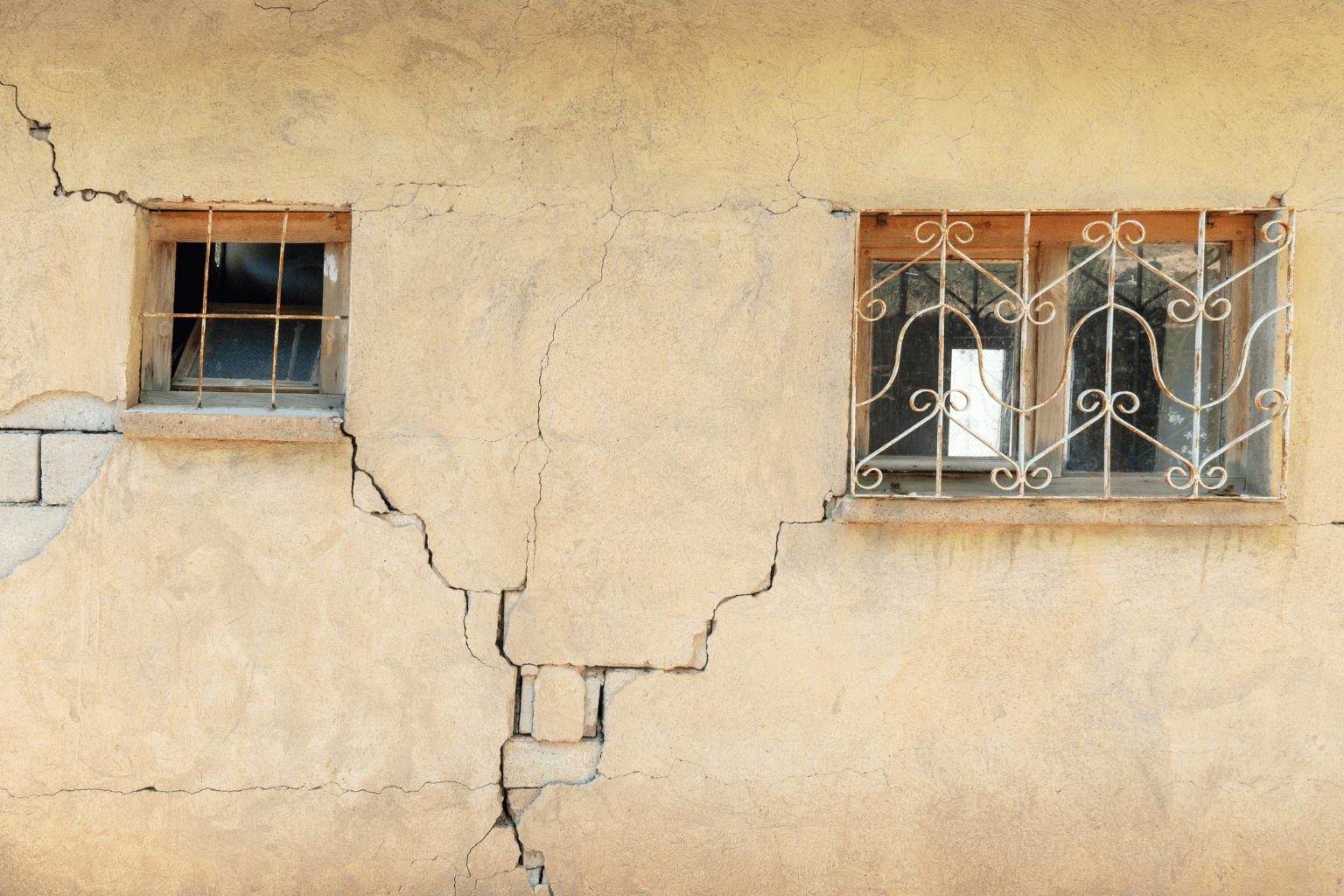 Cracked wall and foundation of a damaged building