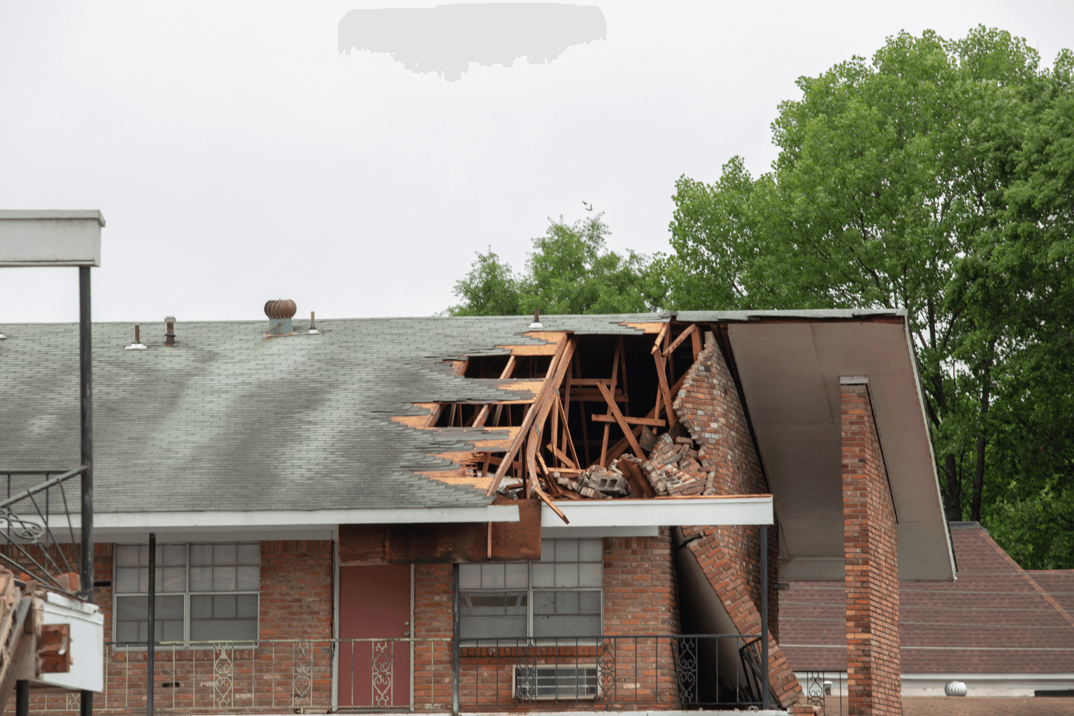 Exterior of a damaged home waiting for insurance repairs