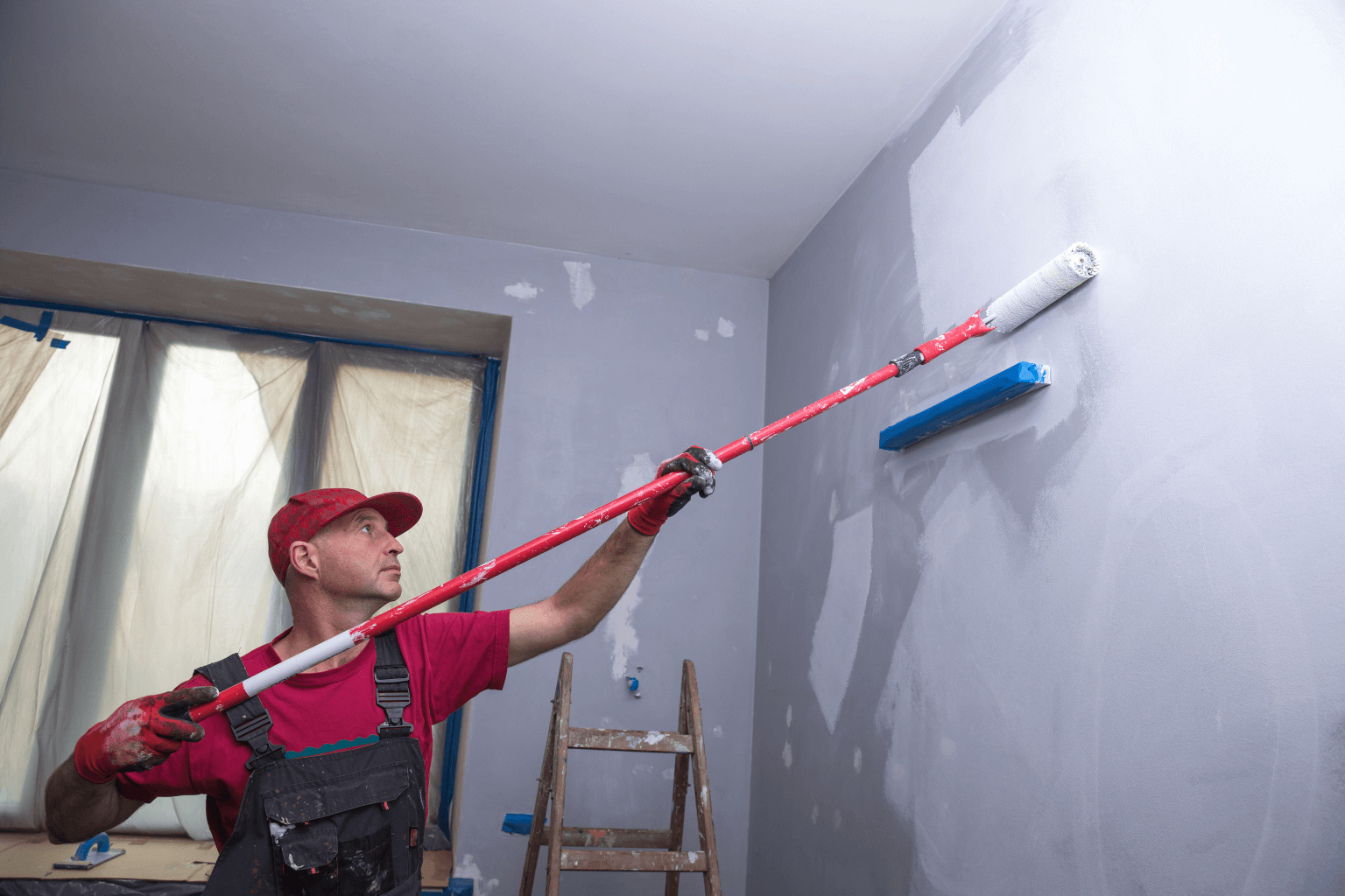 Professional painting over old walls for lead safety