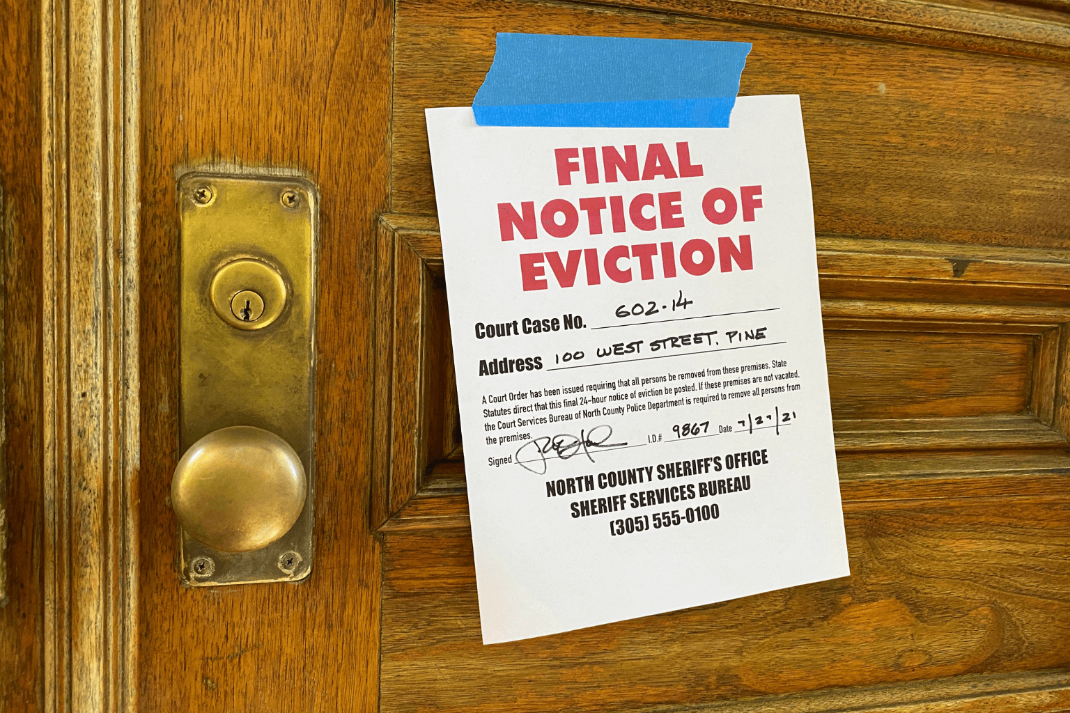 Eviction notice posted on front door of a home