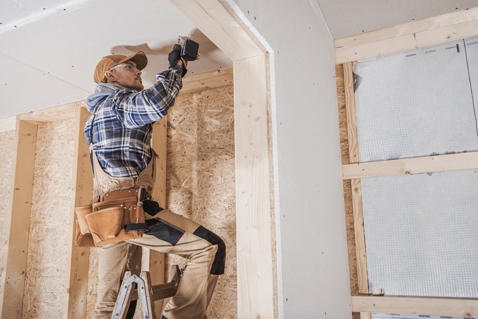 Construction workers restoring fire-damaged home