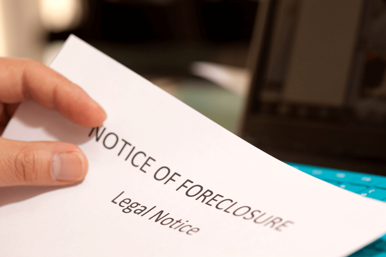 Homeowner reading foreclosure notice