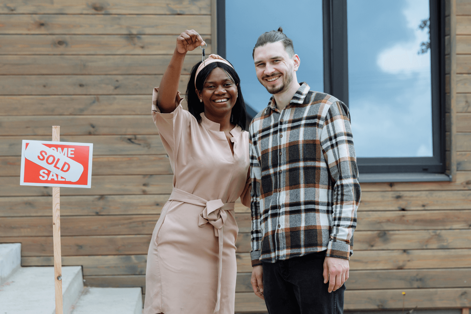 Happy homeowners after selling their hoarder house as-is