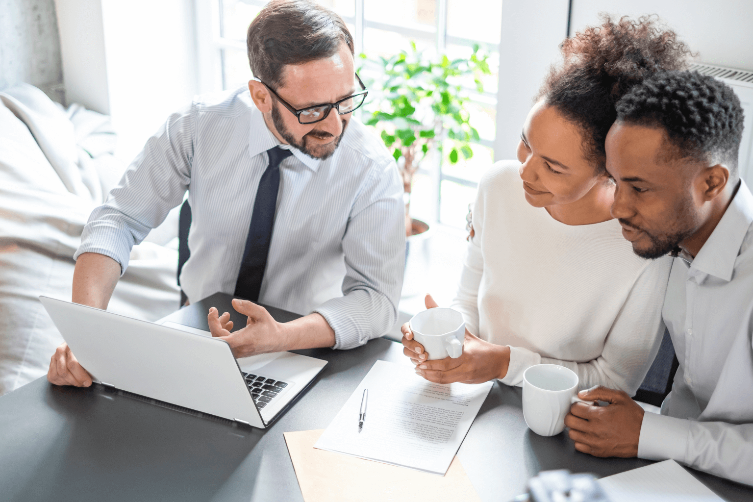 Homebuyers speaking with a real estate agent