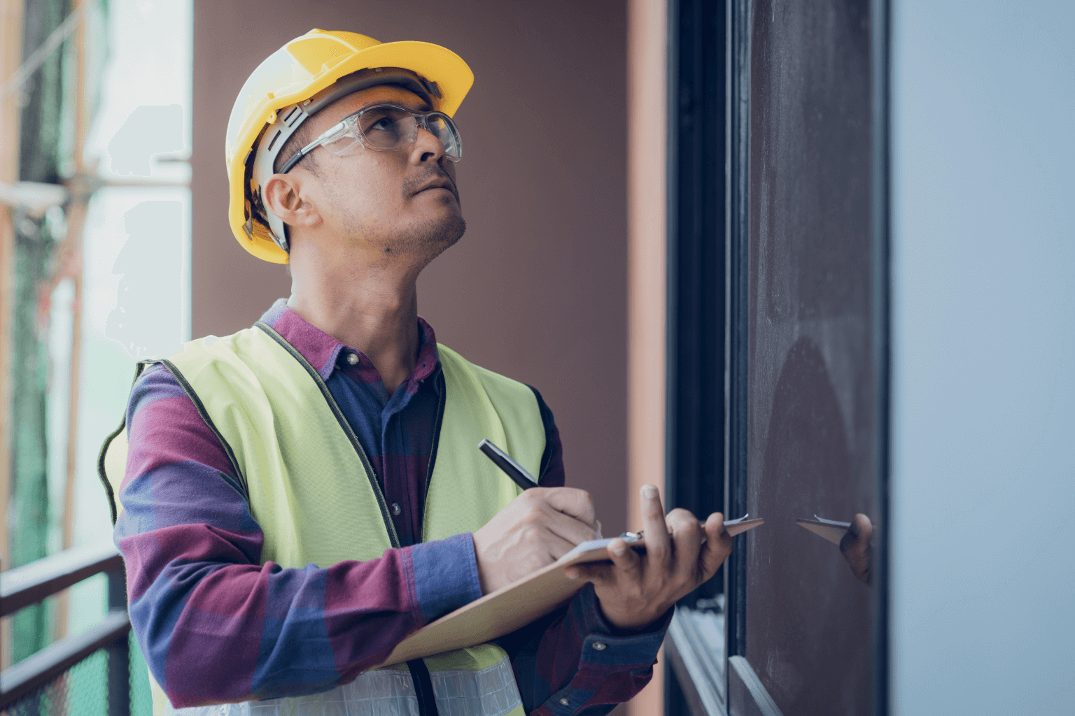 Building inspector checking a house for code violations