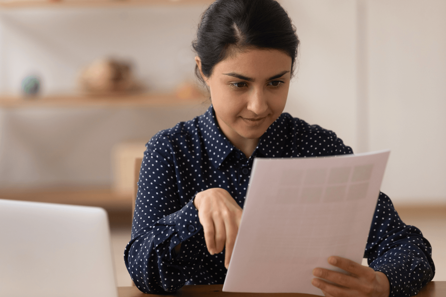 Person reviewing home disclosure documents on a table
