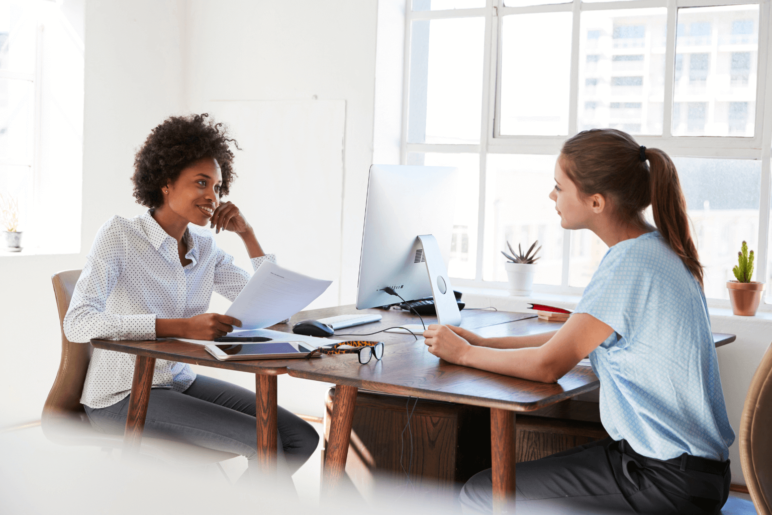 Landlord and tenant talking at a table