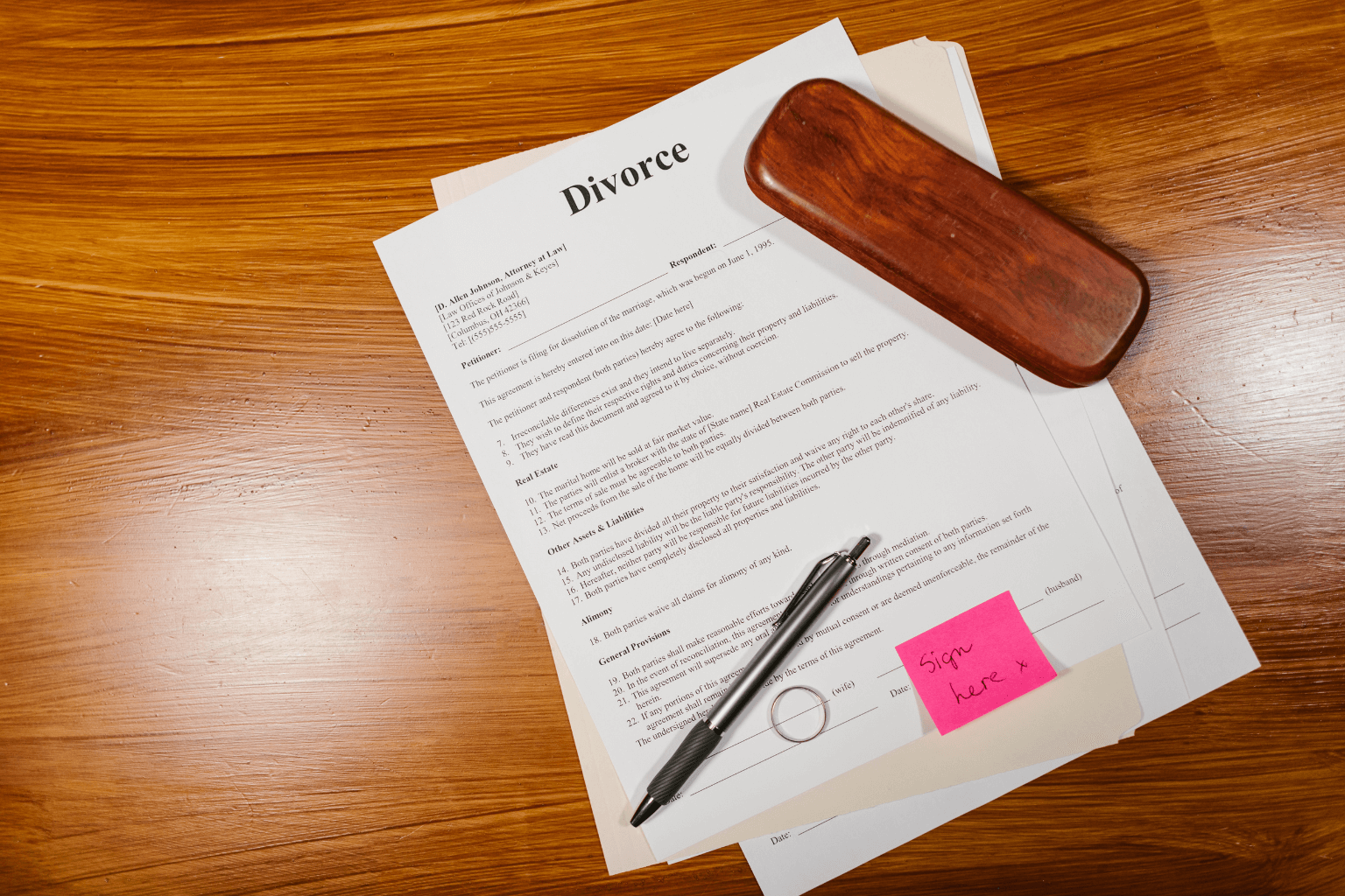 Divorce paperwork and legal documents on a desk
