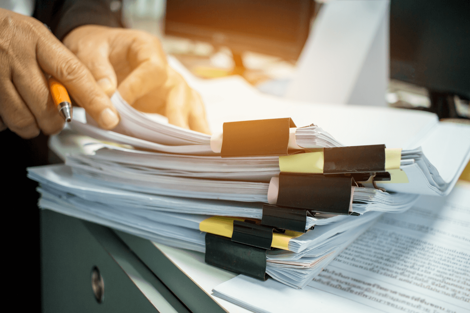Mold inspection documents and home repair photos on a desk